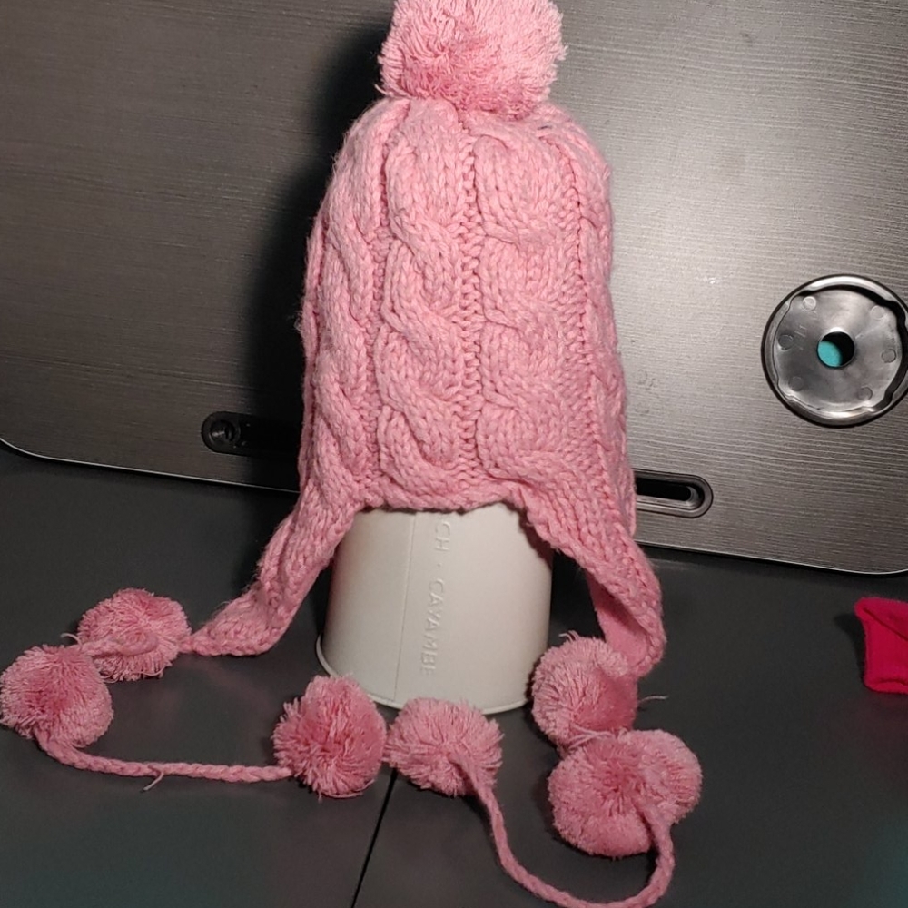 Winter pink knitted beanie with puff balls